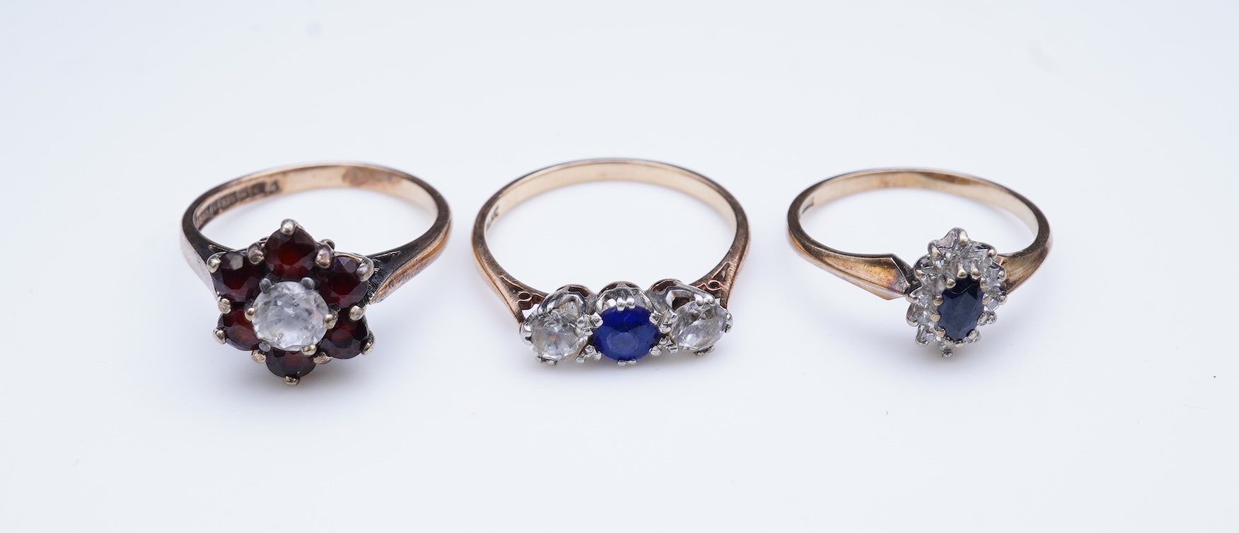 A group of three rings and a tie pin